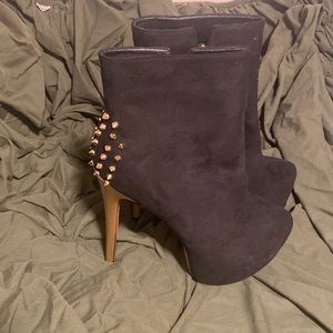Black heels with gold spiked heel.